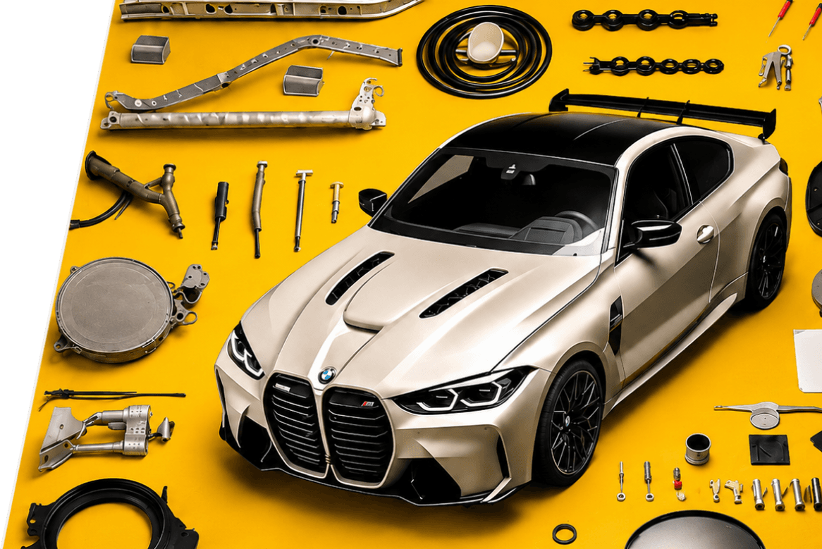 Performance car surrounded by auto parts on a yellow work surface